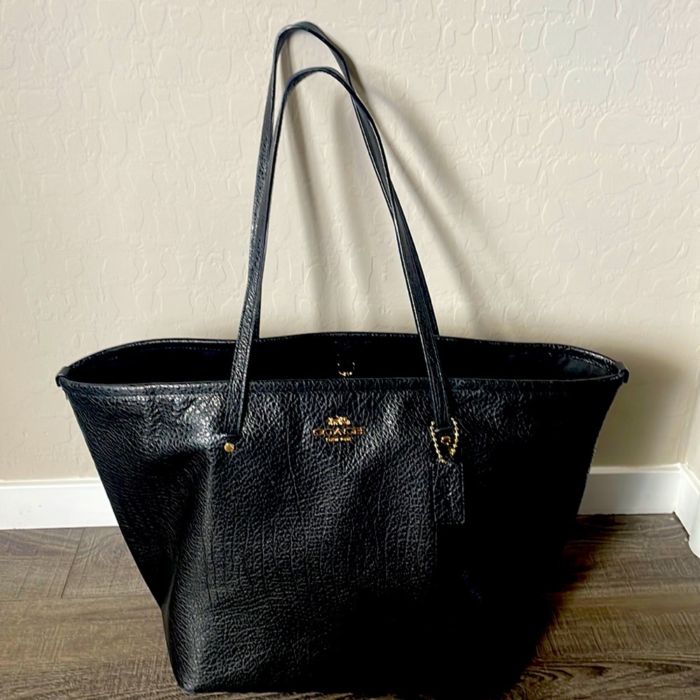 Coach bag. Black with gold accents. 19” x 12”. Used a handful of times.